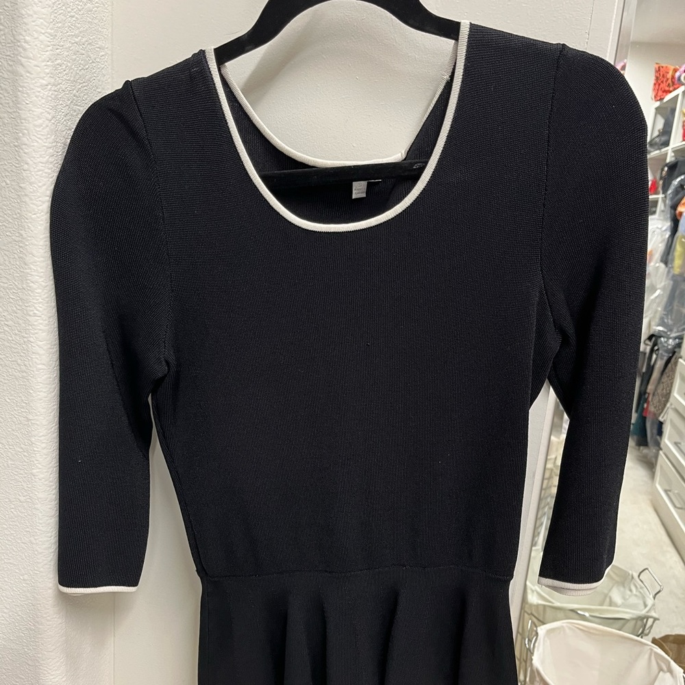 Black 3-4 length, black too with white piping, intermix brand